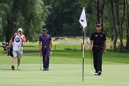 three man standing on golf field thumbnail