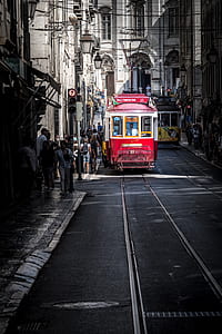 two yellow and red trams on street thumbnail
