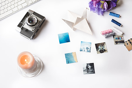 Styled photo with camera and candle thumbnail