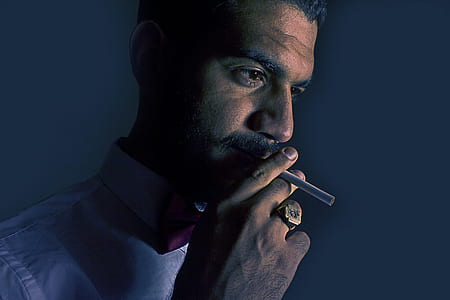 cigarette stick near man mouth thumbnail