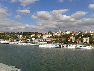 two white pontoon boats docked thumbnail