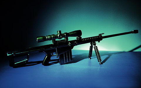 silhouette photography of rifle with bipod thumbnail