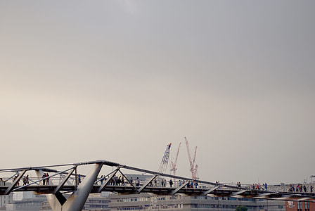 gray metal bridge near crane machine at daytime thumbnail