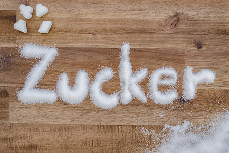 Zucker powder on brown wooden desk thumbnail