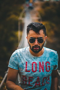 Close-Up Photo of Man Wearing Round Sunglasses thumbnail