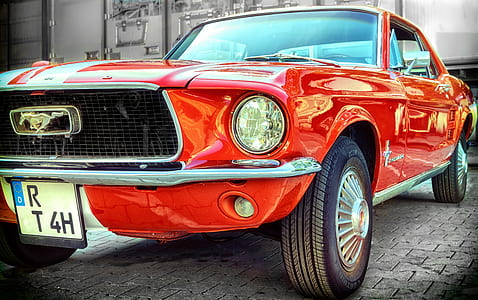 parked red Ford Mustang coupe thumbnail