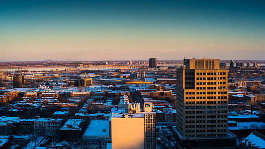 concrete buildings under blue sky thumbnail