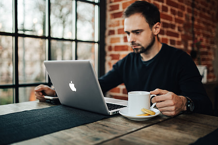 Young Entrepreneur Working from a Modern Cafe thumbnail