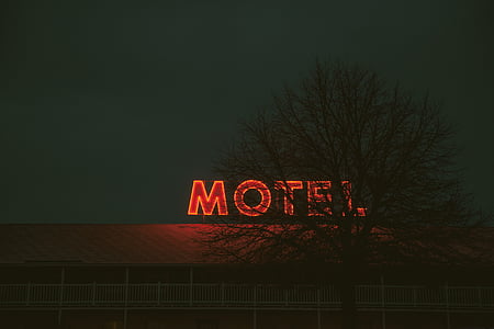 red neon light Motel signage turned ON thumbnail