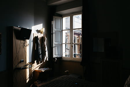 coat hanged near glass window thumbnail