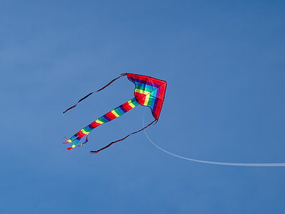 multicolored kite hovering during daytime thumbnail