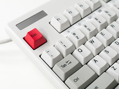 white and red corded computer keyboard close-up photo thumbnail