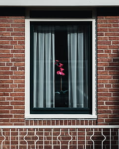 glass window with gray curtains thumbnail