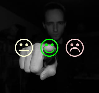 person touching emoji thumbnail