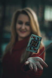 queen of hearts floating over person's hand thumbnail