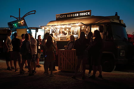 people standing beside food truck thumbnail