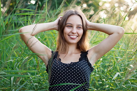 Woman Showing Her Tongue While Holding Her Head thumbnail