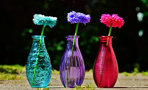 three glass vases on brown floor thumbnail