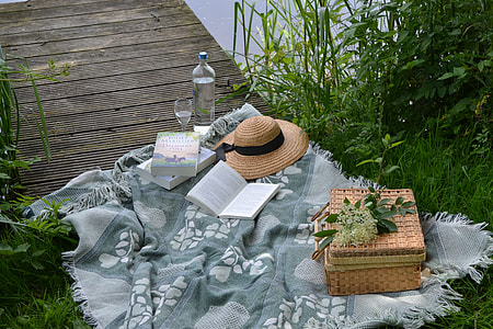 brown wicker basket and sombrero on picnic table thumbnail