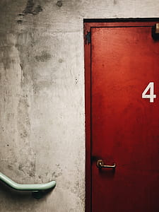 closed red metal door thumbnail