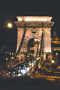 cars crossing bridge during nighttime thumbnail