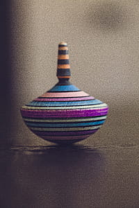 multicolored spinning top toy thumbnail