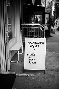 grayscale photo of store signboard thumbnail