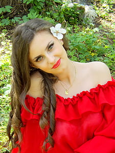 woman wearing off-shoulder top near green leaf plants during day thumbnail