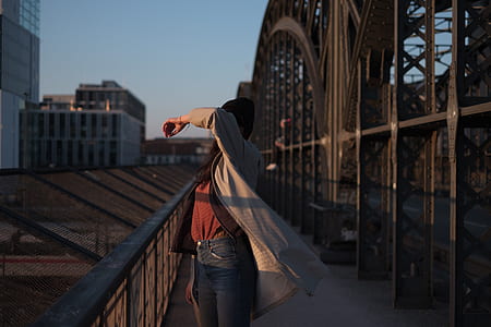 woman standing on bridge thumbnail