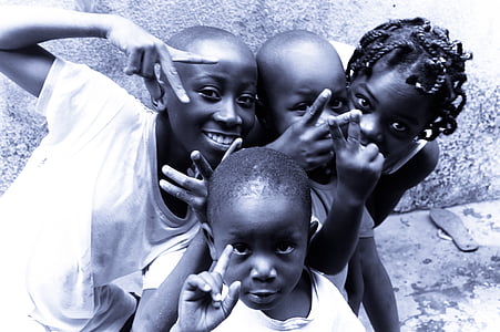 four children taking groupie during daytime thumbnail