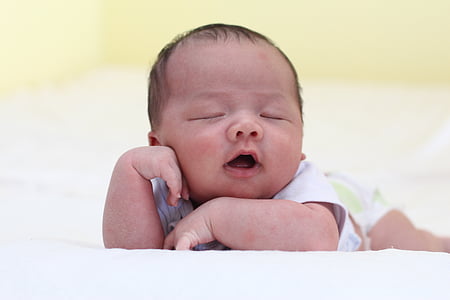 baby leaning on textile thumbnail