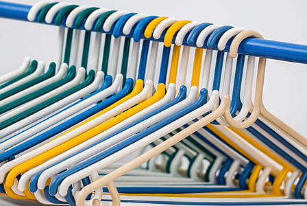 assorted-color plastic clothes hanger lot thumbnail