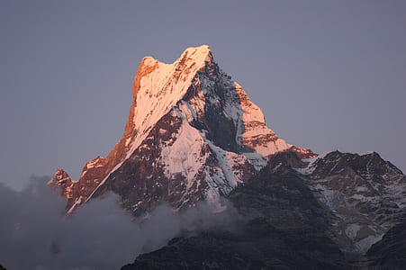 in distant photo of mountain covered by snow thumbnail