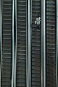 man riding escalator thumbnail