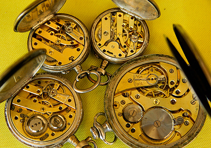 four round gold-colored pocket watches thumbnail
