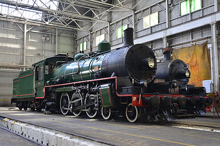 green and black train near brown curtain thumbnail