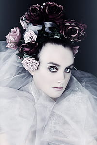 woman wearing flower crown and white dress thumbnail