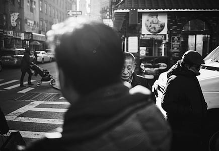 grayscale photography of people walking on road thumbnail