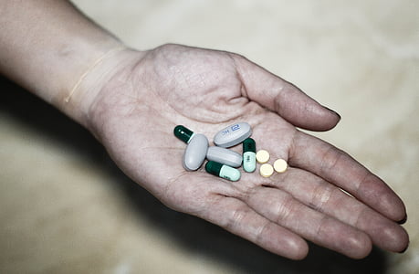 person holding medication pills thumbnail