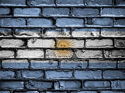 yellow sun painted on brick wall thumbnail