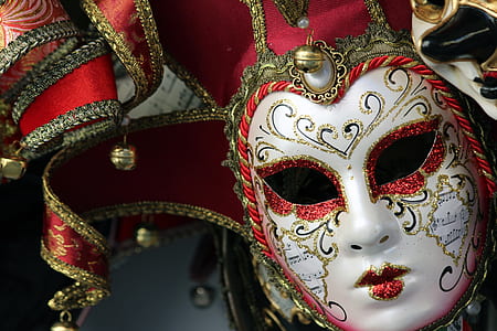 close-up photo of white and red masquerade mask thumbnail