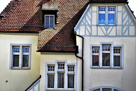 architectural photography of white and brown house thumbnail