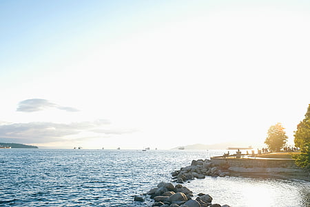 tables and chairs on bay near sea during daytime thumbnail