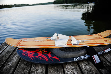 brown wooden snowboard on black dock thumbnail