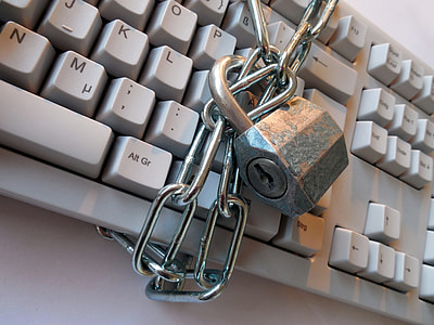 photo of white keyboard with stainless steel chains and padlock thumbnail