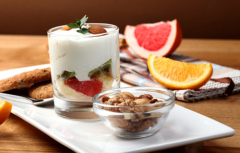 plate with bowl of nuts and glass of fruit salad thumbnail