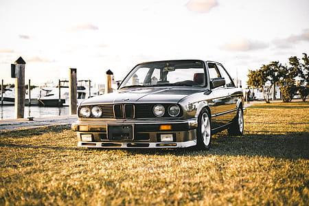 black BMW sedan parked thumbnail
