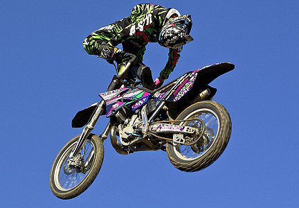 man doing stunt on motocross dirt bike thumbnail