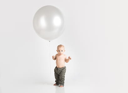 Baby Wearing Gray Pants Photo thumbnail