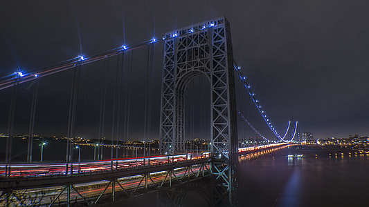 gray bridge during nighttime thumbnail